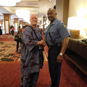 two men smiling at the camera
